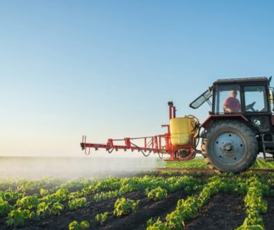 Farmer spraying a soybean field.