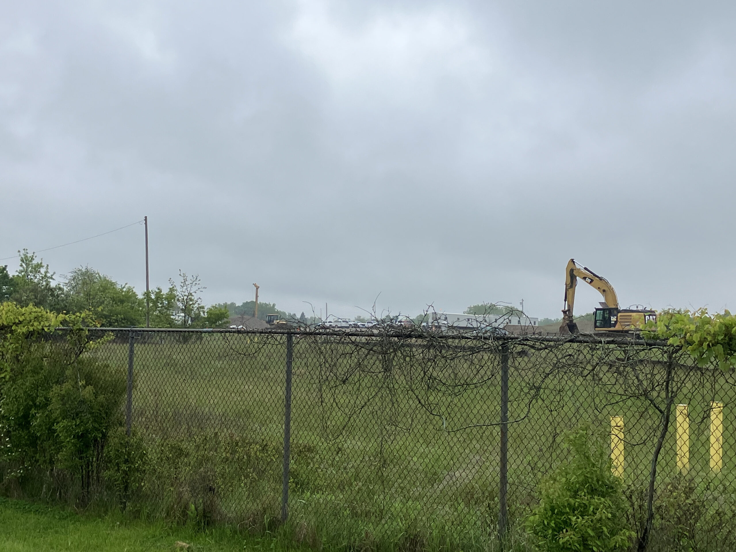 Contractors moving dirt at the Velsicol Superfund site. 