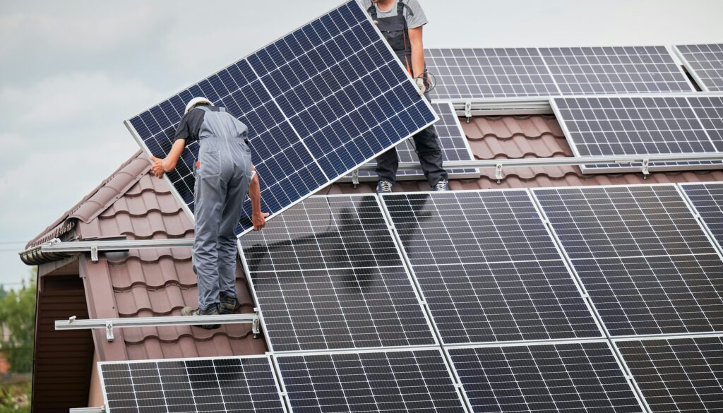 Men installing solar panels