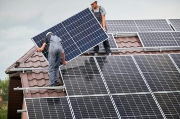 Men installing solar panels