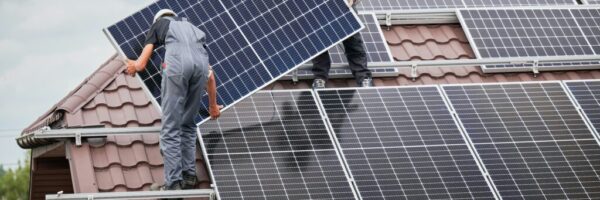 Men installing solar panels