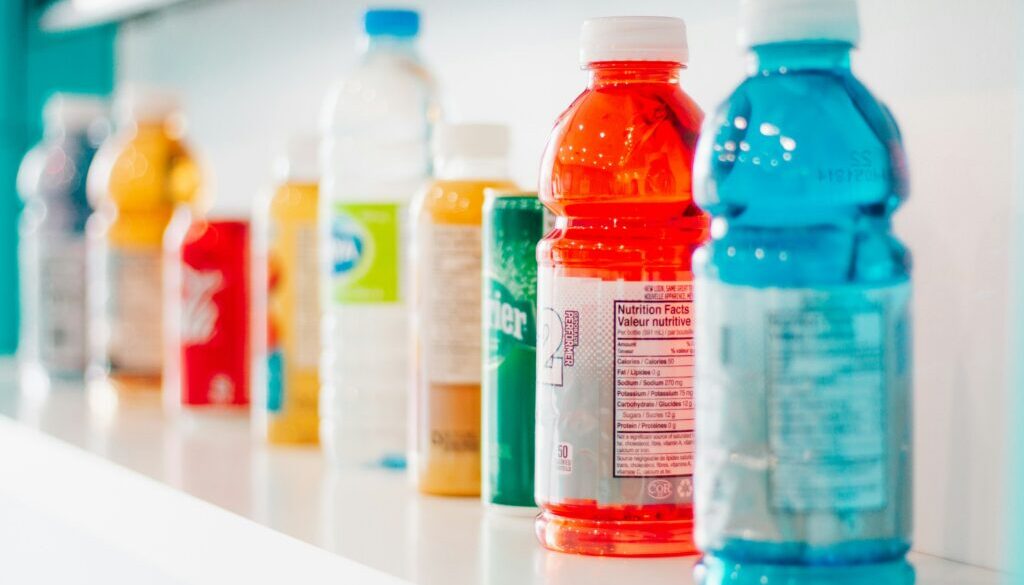 a shelf full of beverages including gatorade