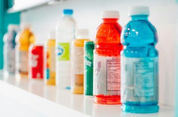 a shelf full of beverages including gatorade