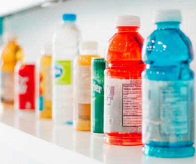 a shelf full of beverages including gatorade