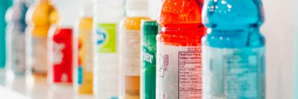 a shelf full of beverages including gatorade