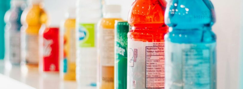shayna-douglas-7r5jMqhgg00-unsplash a shelf full of beverages including gatorade