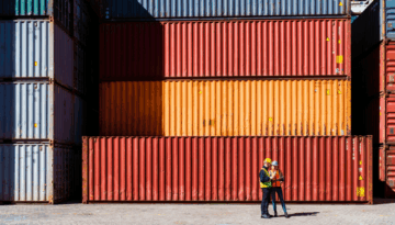 High res image-Workers in front of transportation cargo containers