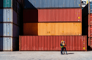 High res image-Workers in front of transportation cargo containers