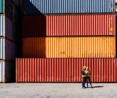 High res image-Workers in front of transportation cargo containers